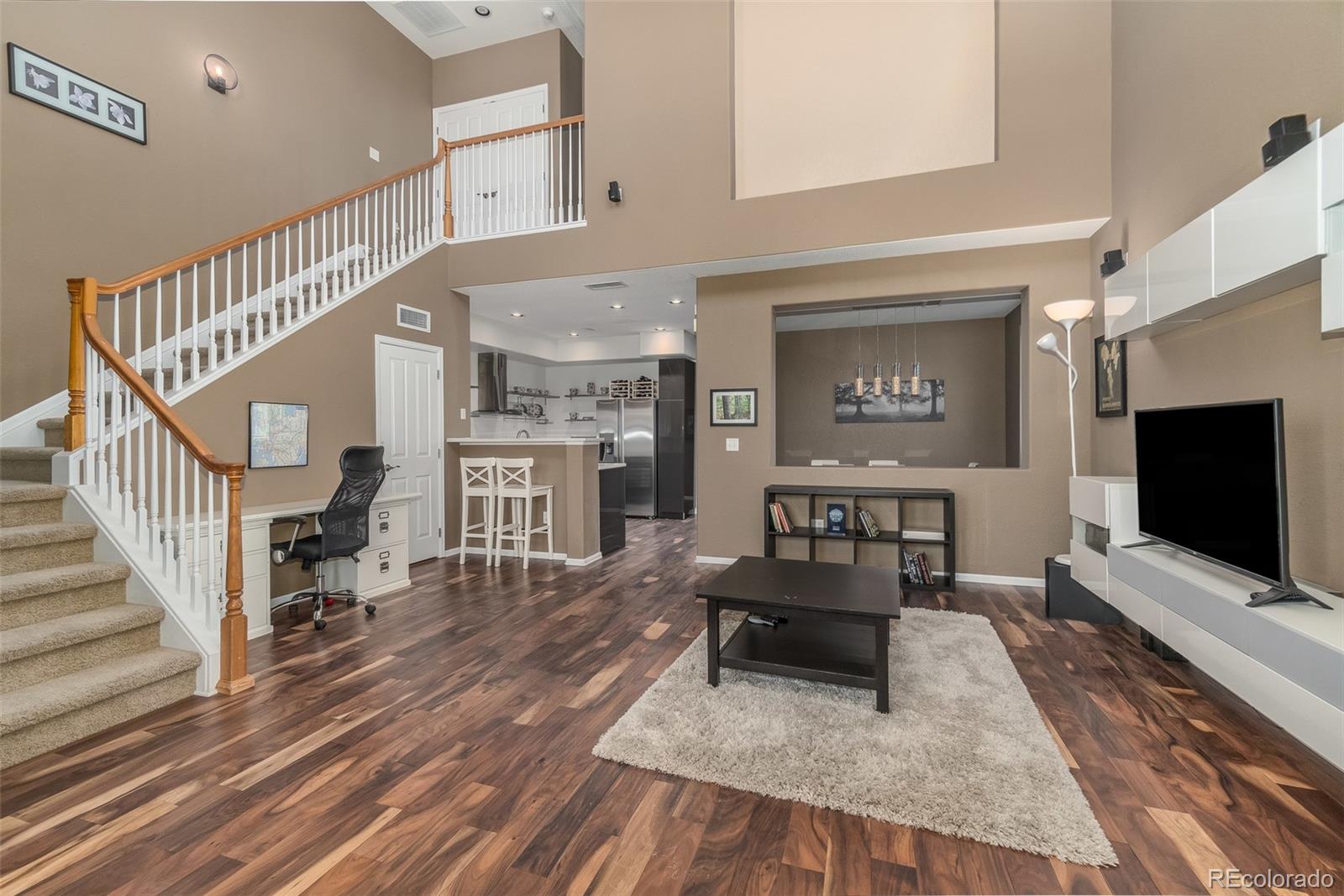 Welcome home to Highland Walk! Soaring ceilings and beautiful wood floors