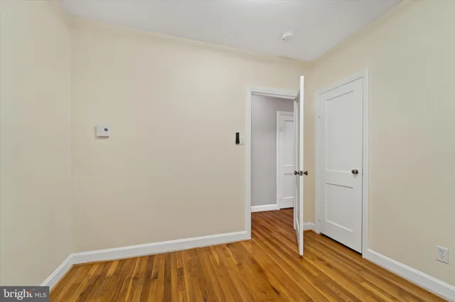 a view of room with wooden floor