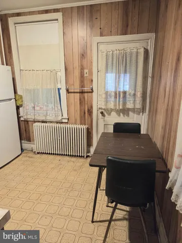 a view of a balcony with a sink and wooden floor