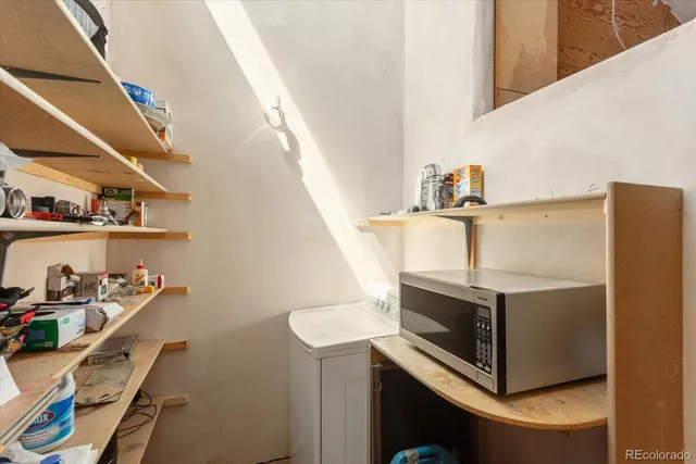 a bathroom with a shower and a sink