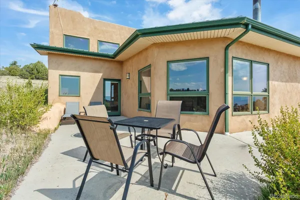 a view of a backyard with a patio and mountain view