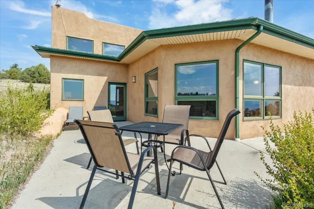 a view of a backyard with a patio and mountain view