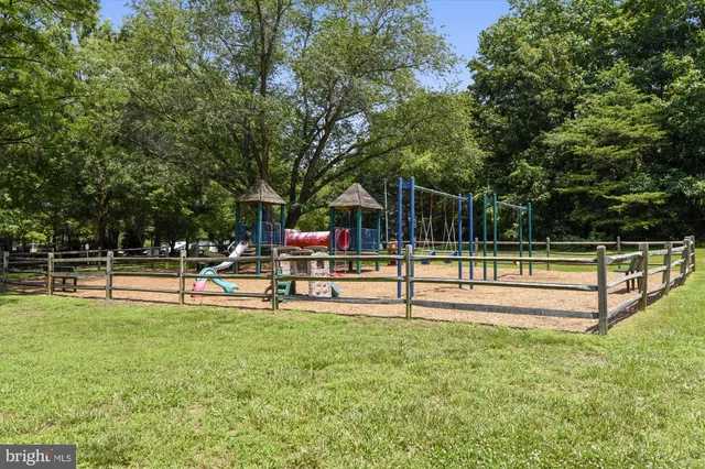 a view of a park with swings and slides