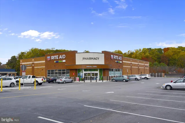 a view of a cars park in front of a building