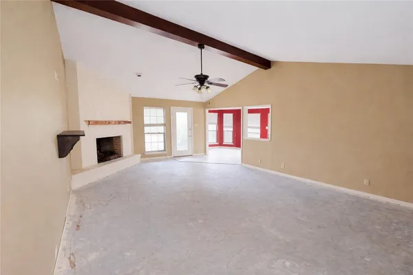 a spacious bathroom with a granite countertop sink and a mirror