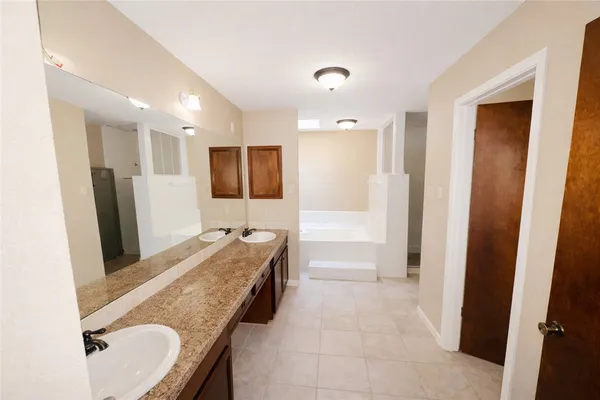 a view of a house with a yard and garage