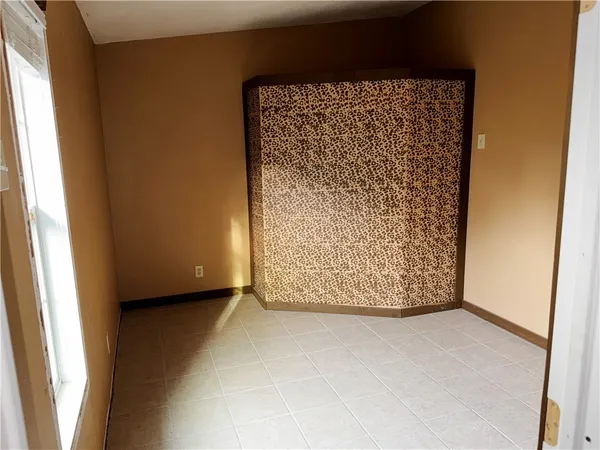 a spacious bathroom with a granite countertop sink and a mirror