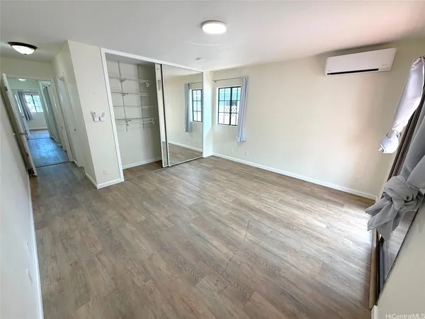 a spacious bathroom with a double vanity sink a mirror and a bathtub