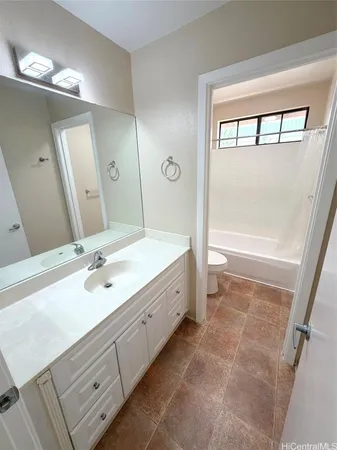 a bathroom with a toilet and a bathtub