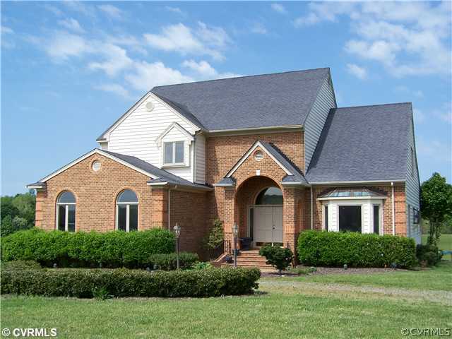 2360 Windy Run Road Manakin-Sabot, VA 23103 - Photo 1 of 12 a front view of a house with a yard