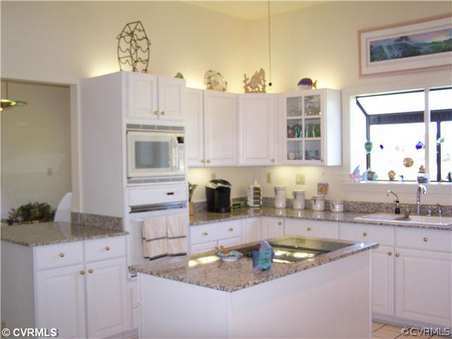 2360 Windy Run Road Manakin-Sabot, VA 23103 - Photo 6 of 12 a kitchen with kitchen island granite countertop a sink a stove and cabinets