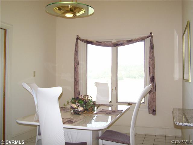2360 Windy Run Road Manakin-Sabot, VA 23103 - Photo 8 of 12 a view of a dining room with furniture and chandelier