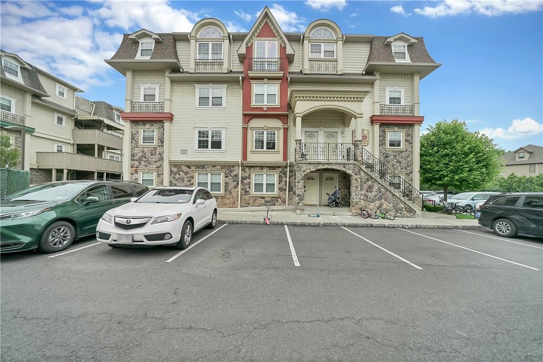 a front view of a house with parking space