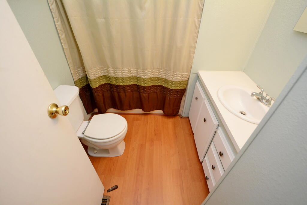 623 Periwinkle Circle Barefoot Bay, FL 32976 - Photo 18 of 37 a bathroom with a toilet and a tub