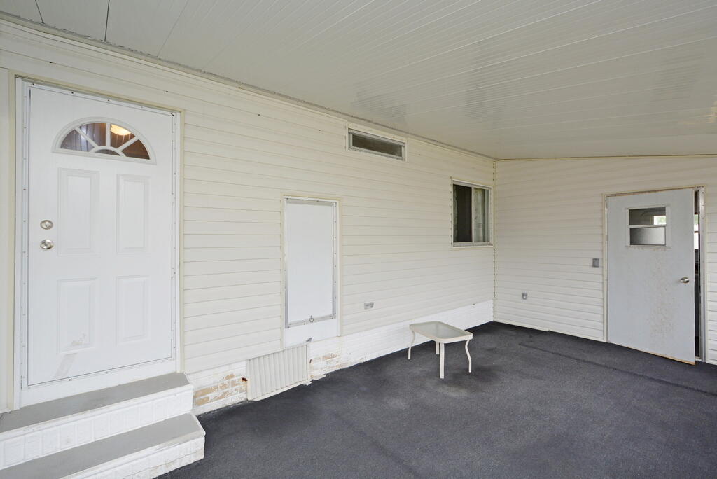 623 Periwinkle Circle Barefoot Bay, FL 32976 - Photo 26 of 37 a view of an empty room