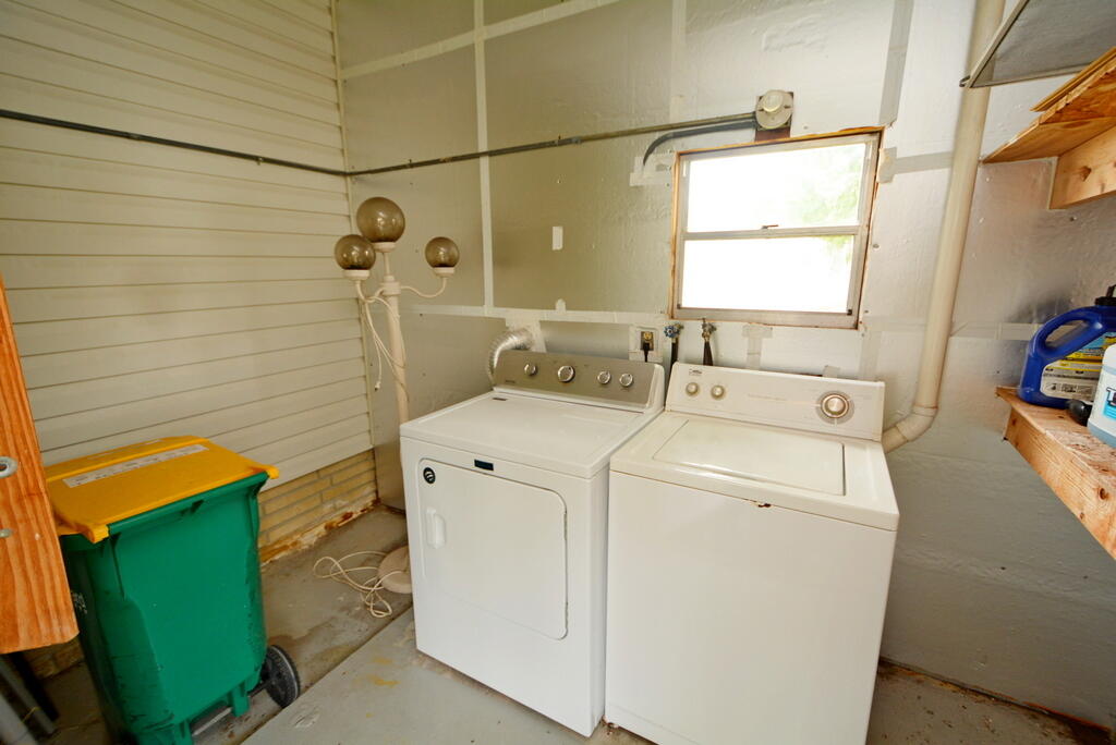 623 Periwinkle Circle Barefoot Bay, FL 32976 - Photo 28 of 37 a utility room with dryer and washer