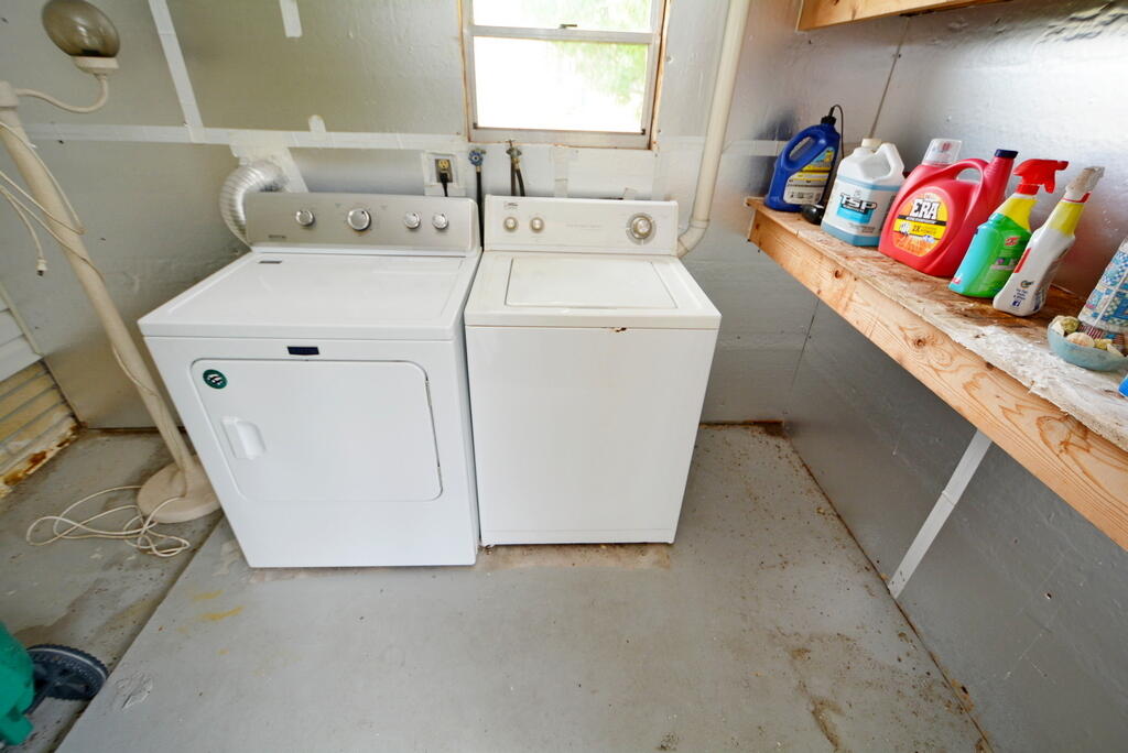 623 Periwinkle Circle Barefoot Bay, FL 32976 - Photo 29 of 37 a utility room with dryer and washer