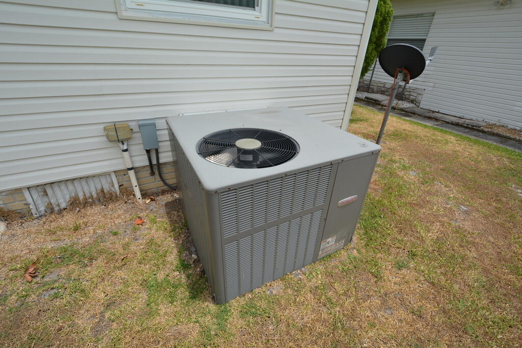 623 Periwinkle Circle Barefoot Bay, FL 32976 - Photo 35 of 37 a bathroom with a sink and a vanity