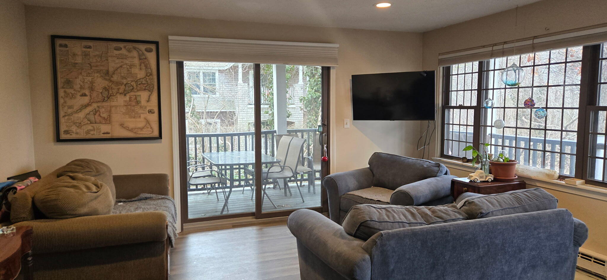190 Route 6A, Unit 9B Orleans, MA 02653 - Photo 3 of 12 a living room with furniture and a flat screen tv