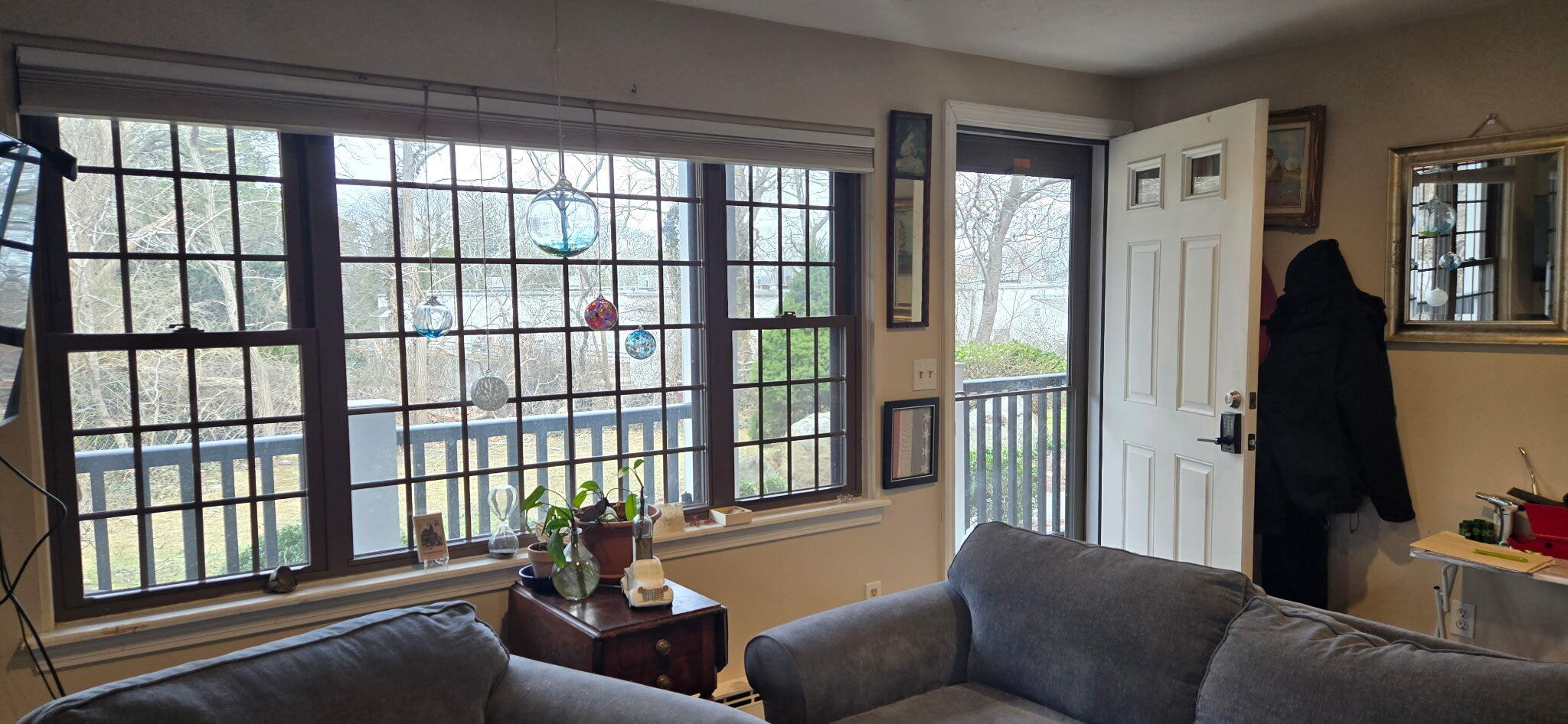 190 Route 6A, Unit 9B Orleans, MA 02653 - Photo 4 of 12 a living room with furniture and a large window