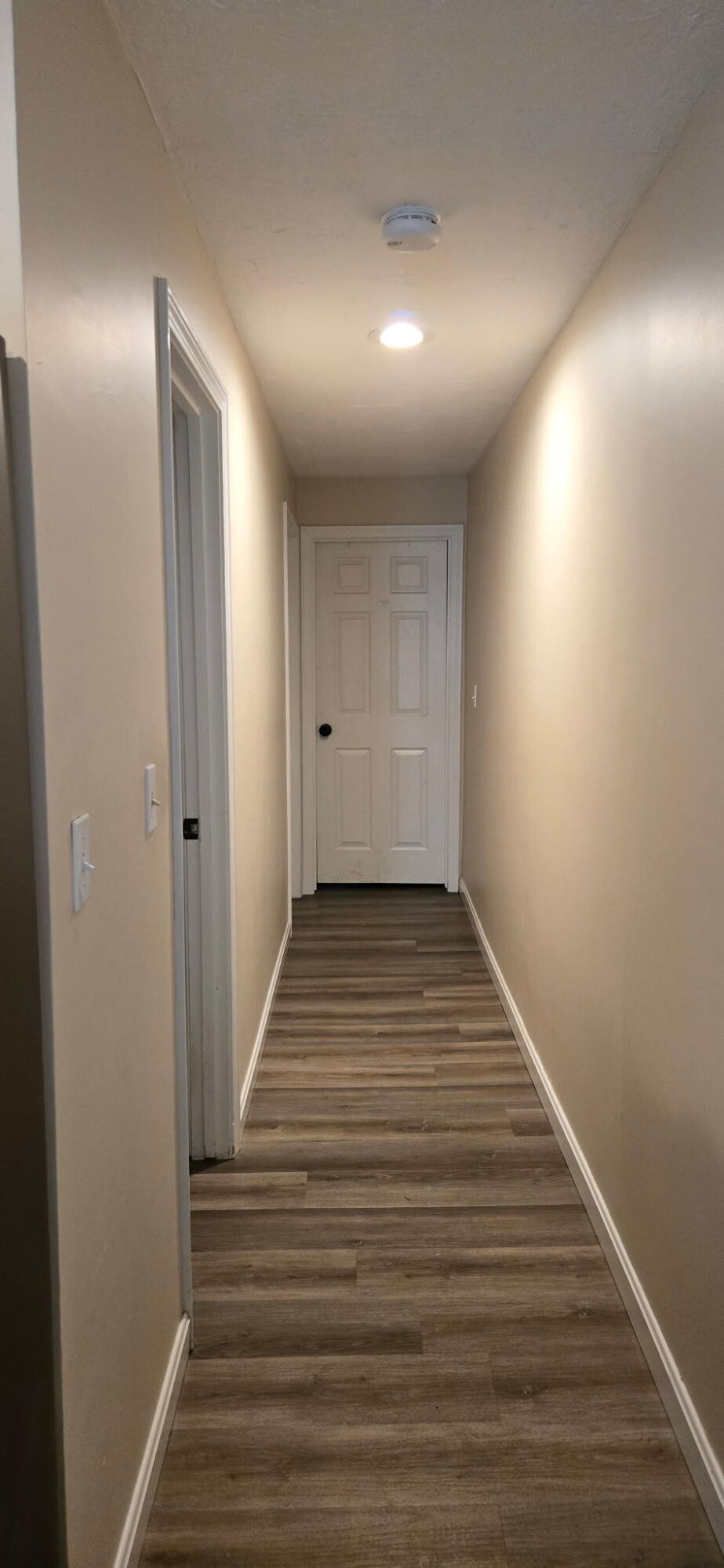 190 Route 6A, Unit 9B Orleans, MA 02653 - Photo 9 of 12 a view of a hallway with wooden floor