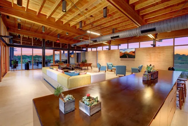 a living room with furniture and a table