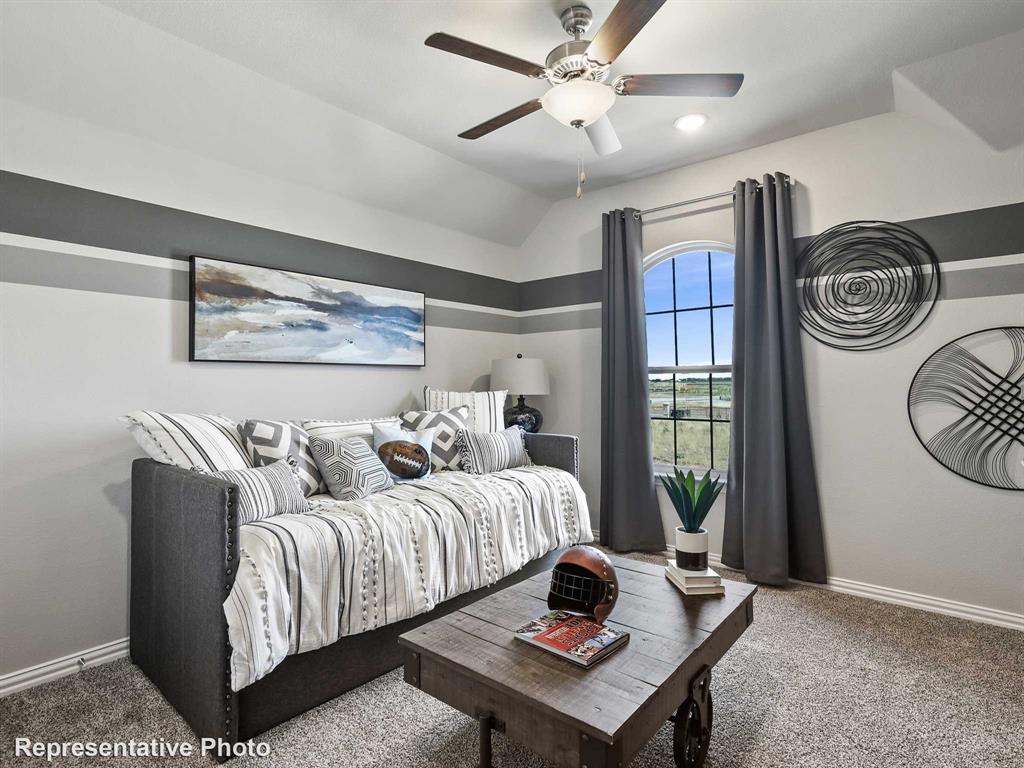 1143 Rothland Lane Red Oak, TX 75154 - Photo 16 of 18 Vaulted ceiling with a flush-mount light fixture and ceiling fan