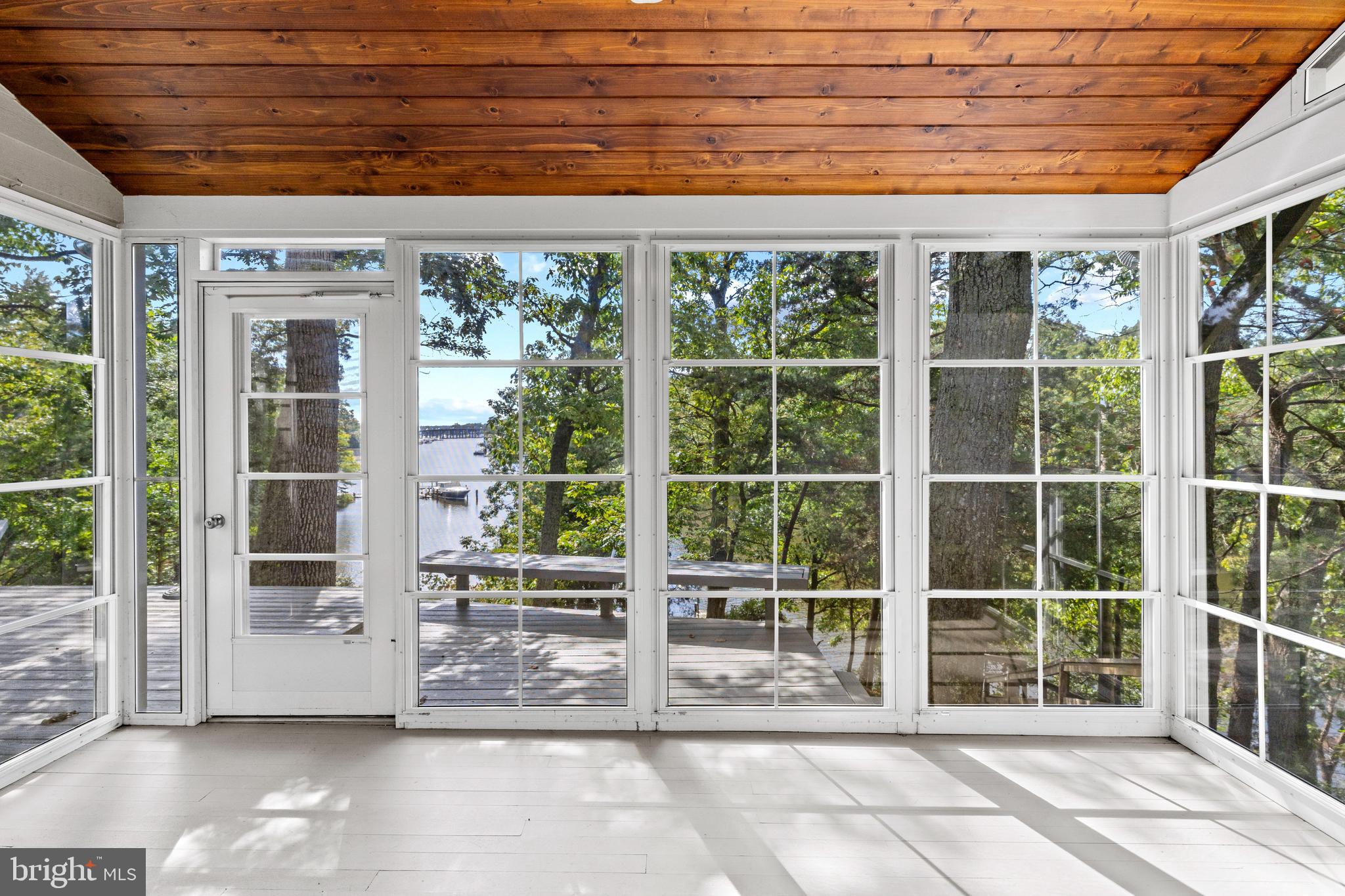 105 Wallace Manor Road Edgewater, MD 21037 - Photo 11 of 35 Screened porch deck access and views
