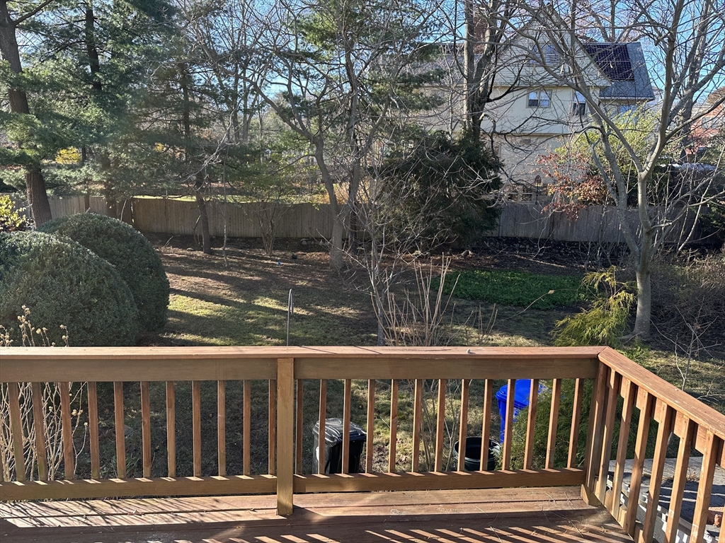 18 Cushing Road Brookline, MA 02445 - Photo 4 of 6 a view of a brick house with a small yard