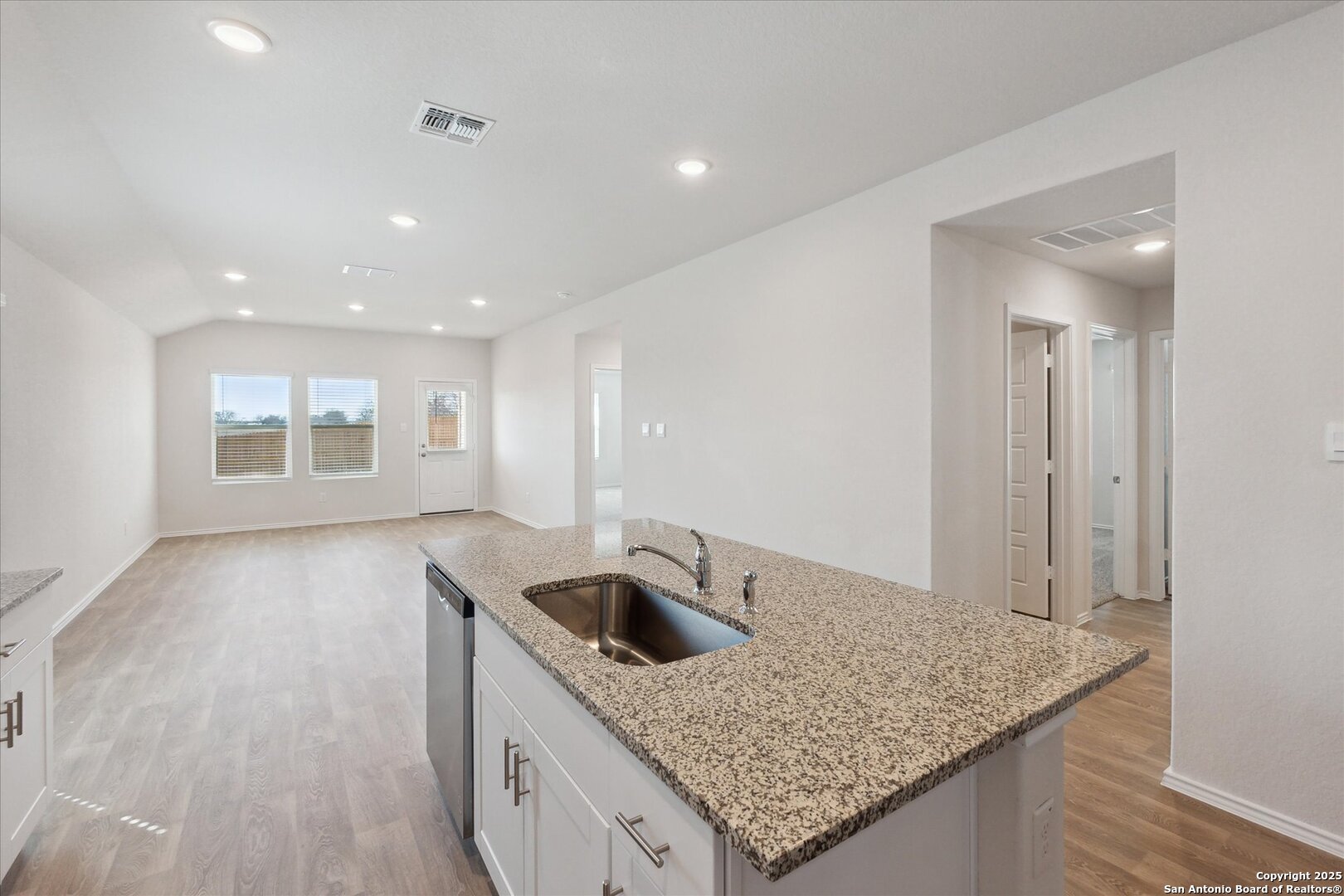 1632 Layne Loop New Braunfels, TX 78130 - Photo 11 of 34 a kitchen with a sink a counter top space and cabinets