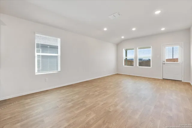a view of empty room with windows