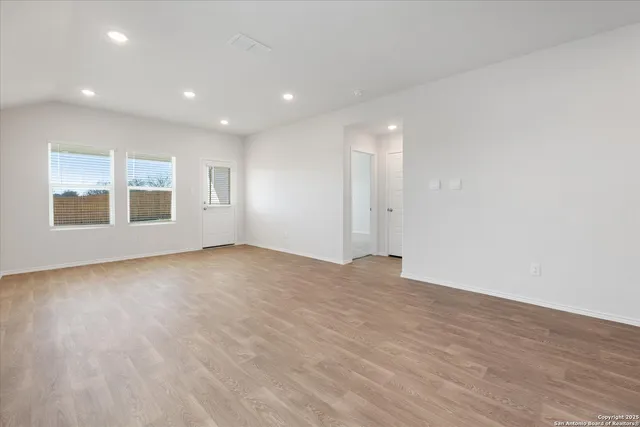 a view of an empty room with a window