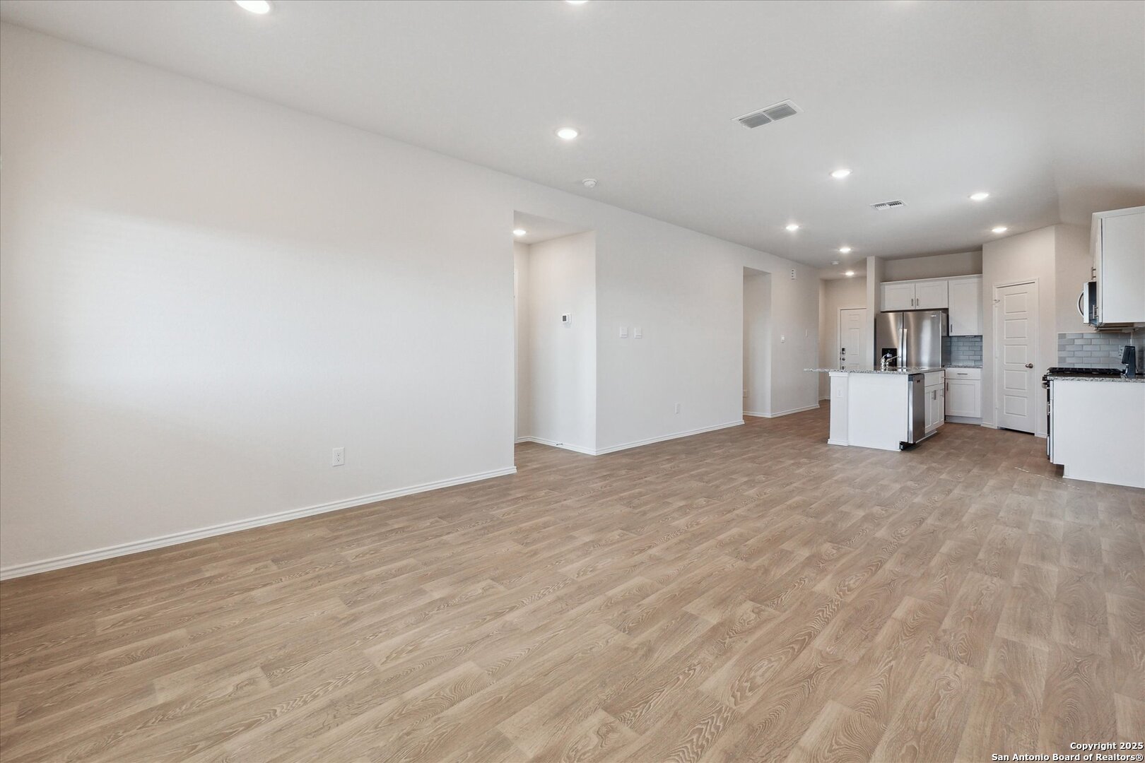 1632 Layne Loop New Braunfels, TX 78130 - Photo 17 of 34 a view of empty room with wooden floor