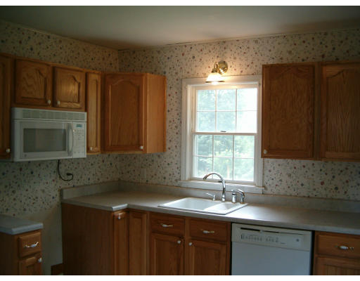 96 Anzio Road Athol, MA 01331 - Photo 2 of 8 a kitchen with stainless steel appliances granite countertop a sink stove and cabinets