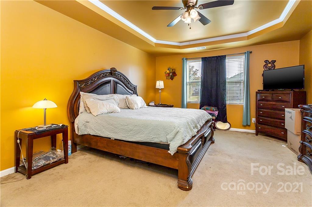 3016 Aransas Road Charlotte, NC 28214 - Photo 13 of 24 a bedroom with a bed and a television