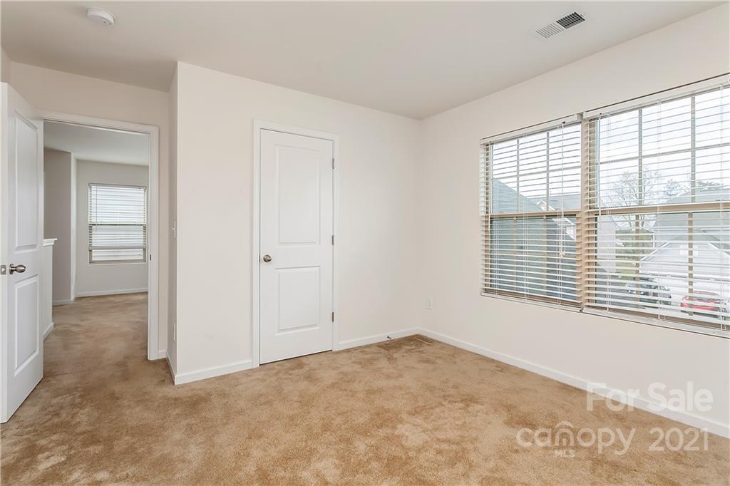 3016 Aransas Road Charlotte, NC 28214 - Photo 17 of 24 a view of an empty room with a window