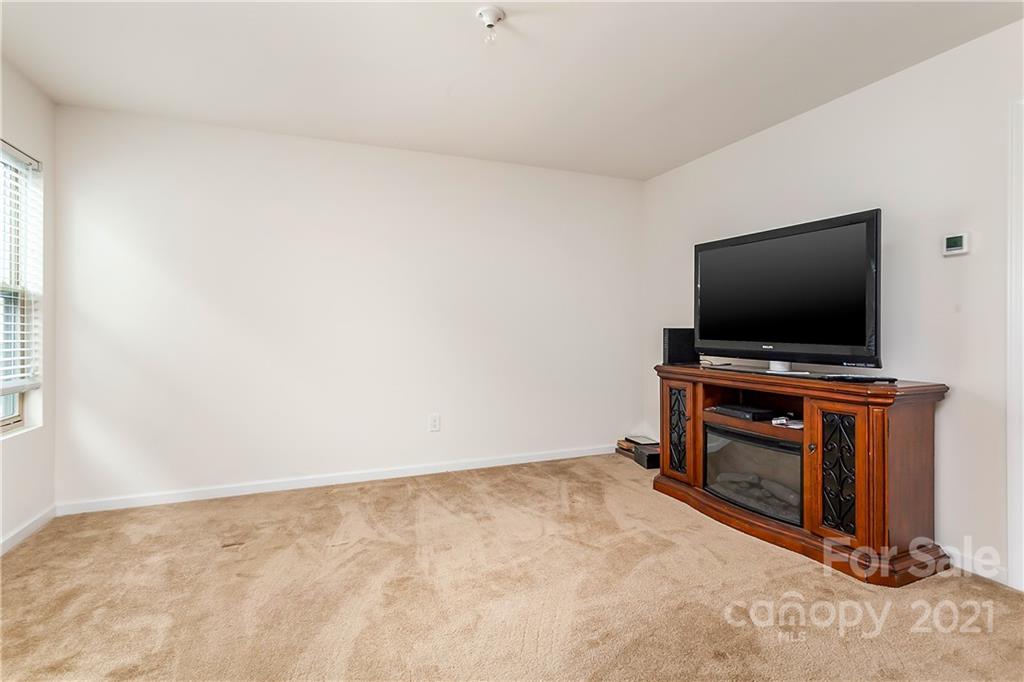3016 Aransas Road Charlotte, NC 28214 - Photo 18 of 24 a room with furniture and flat screen tv