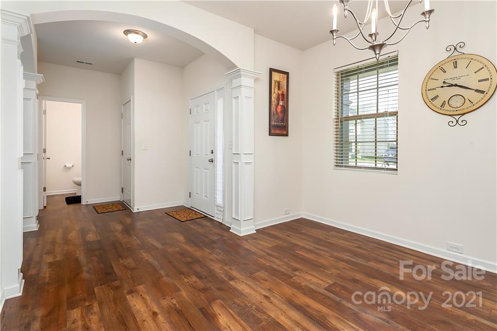3016 Aransas Road Charlotte, NC 28214 - Photo 5 of 24 a view of empty room with window and wooden floor