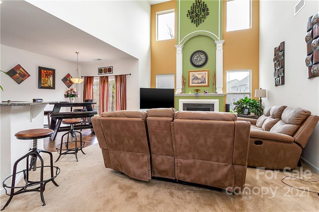 3016 Aransas Road Charlotte, NC 28214 - Photo 7 of 24 a living room with furniture and a clock
