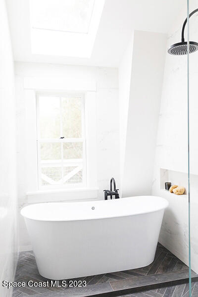 14 Ocean River Drive Cocoa Beach, FL 32931 - Photo 11 of 15 a white bath tub sitting in a bathroom