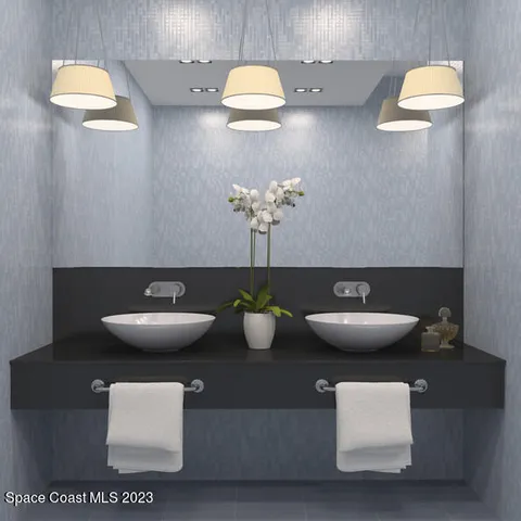 a bathroom with a double vanity sink toilet and shower