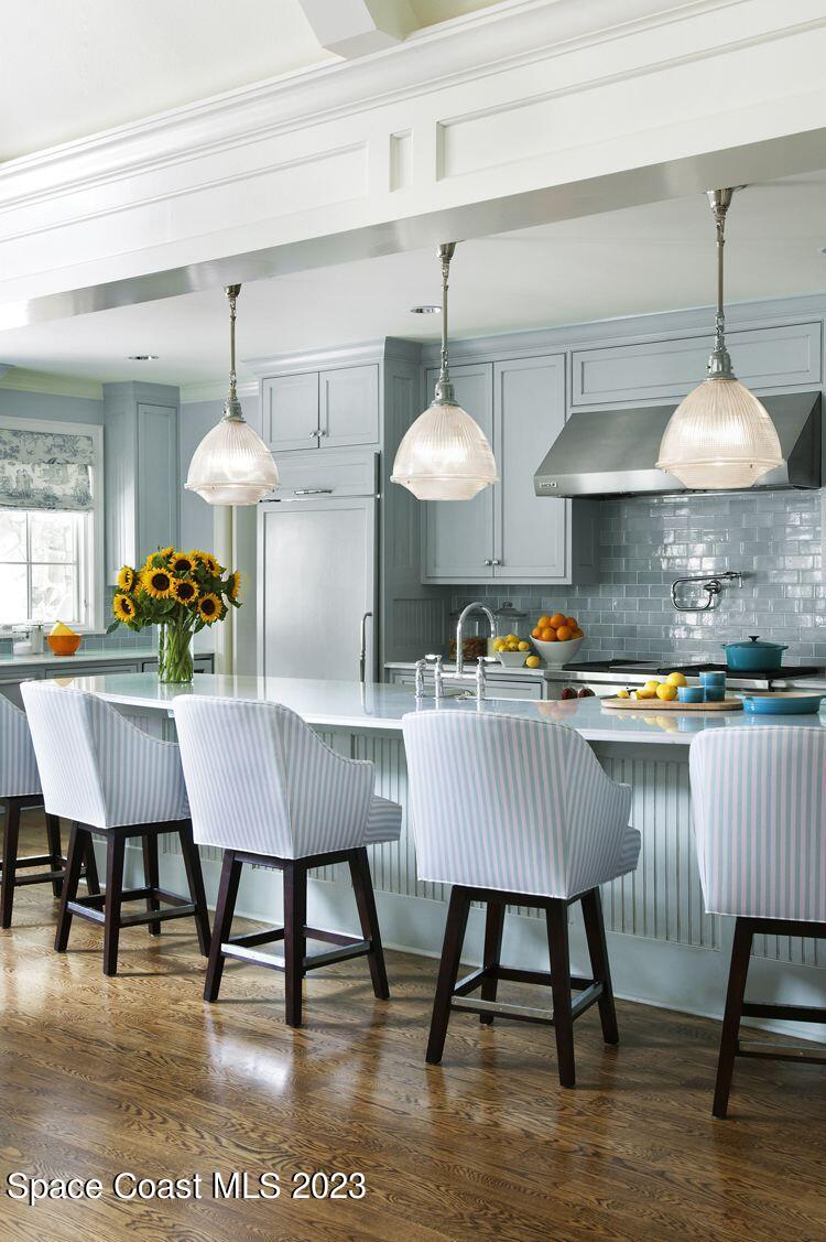 14 Ocean River Drive Cocoa Beach, FL 32931 - Photo 13 of 15 a view of a dining room with furniture and wooden floor