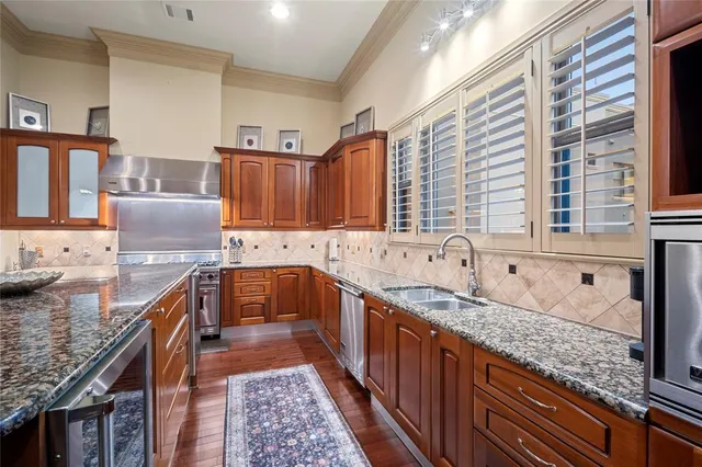 a kitchen with granite countertop a sink and a counter