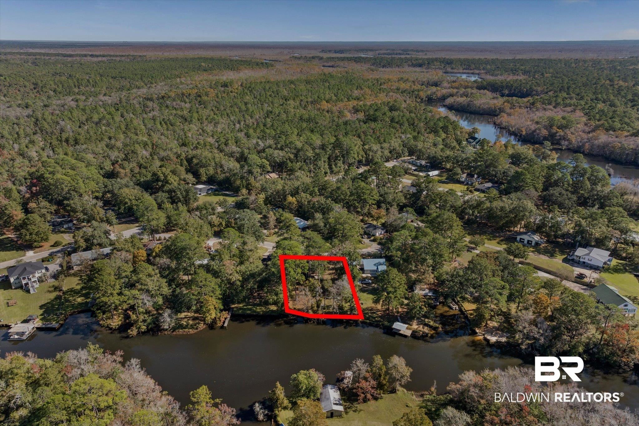 431 Simms Drive Saraland, AL 36571 - Photo 22 of 34 Aerial view of property and surrounding area with a large body of water and property boundaries highlighted