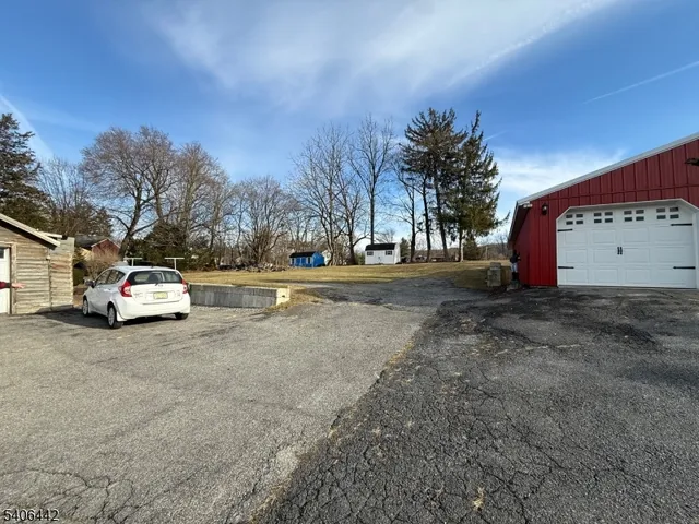 a view of street with large trees