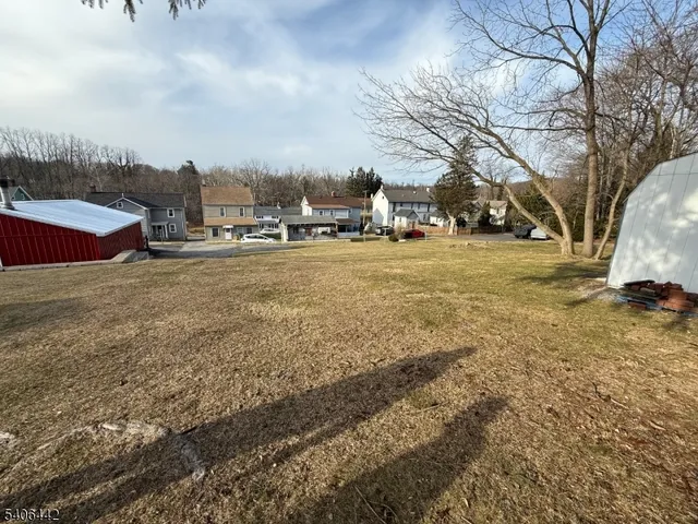a view of road with large trees