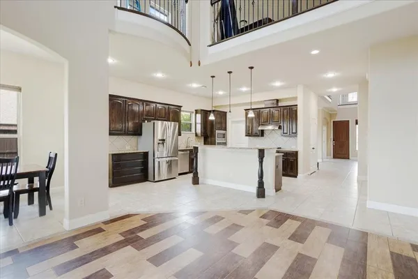 a view of entryway and hall with a front door