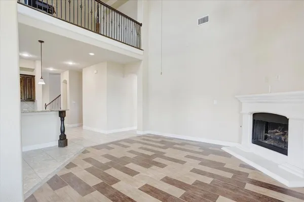 a dining room with furniture a chandelier and a rug