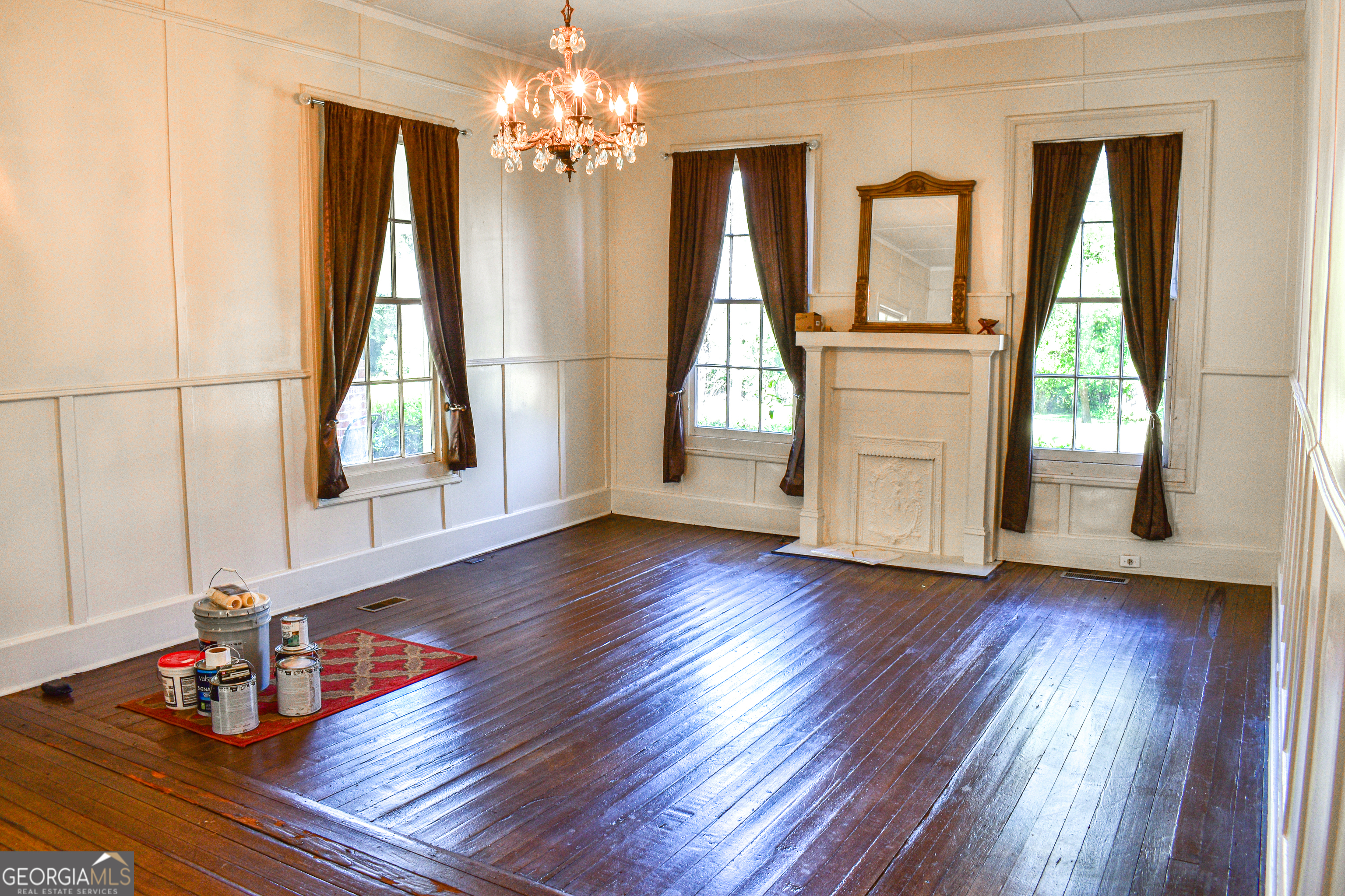 100 Minor Avenue Montezuma, GA 31063 - Photo 11 of 43 a view of a room with wooden floor and chandelier