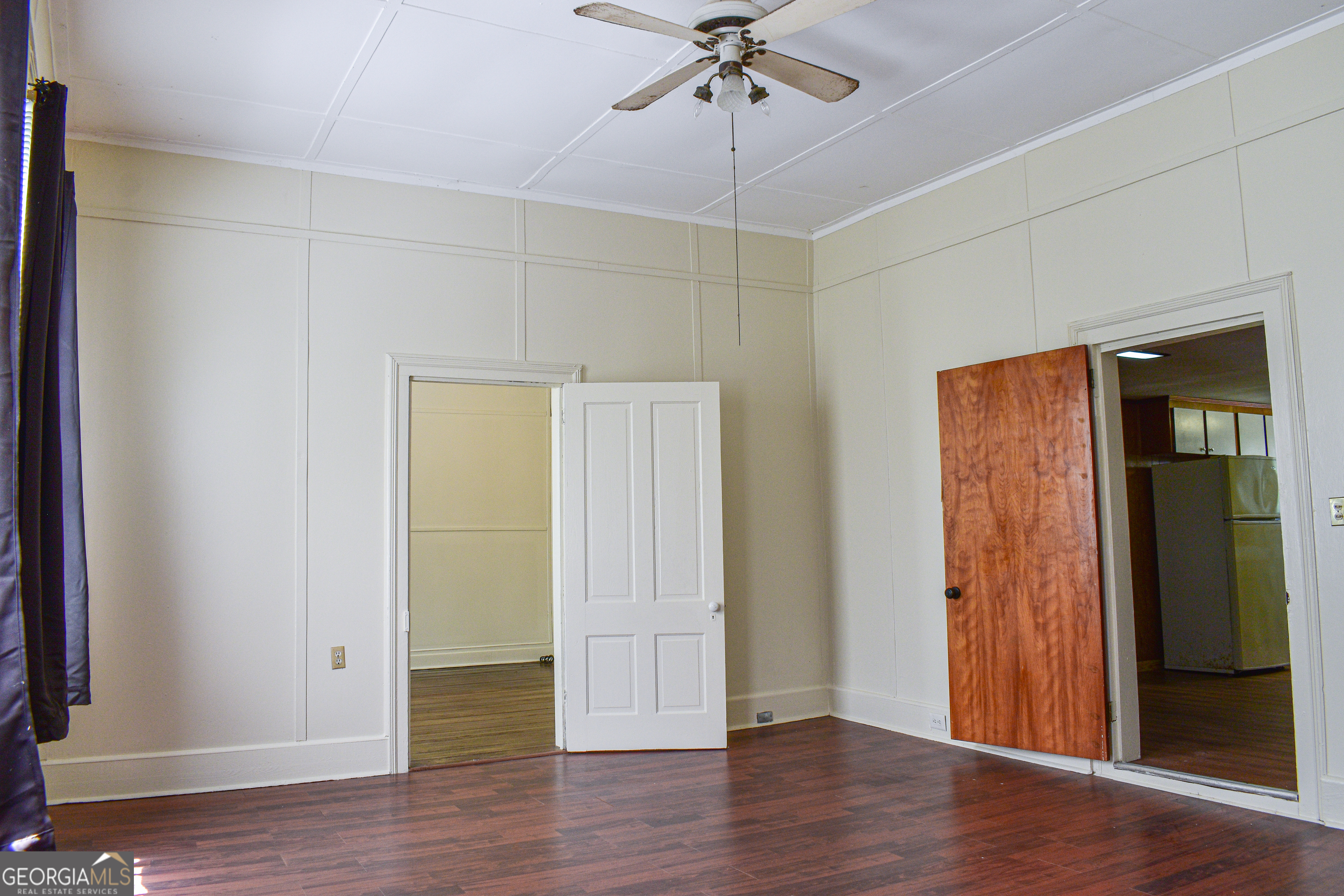 100 Minor Avenue Montezuma, GA 31063 - Photo 20 of 43 an empty room with wooden floor closet and windows